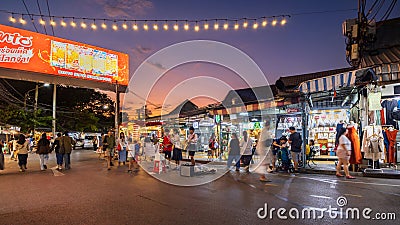 Evening time At Chatuchak Market, witness young performers and street musicians showcasing diverse talents through busking and Editorial Stock Photo