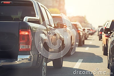 Evening traffic jam on busy city highway. Rows of car stck on road due to crush accident. Sunset metropolis rush hour scene Stock Photo