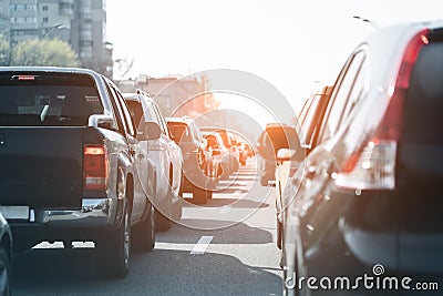 Evening traffic jam on busy city highway. Rows of car stck on road due to crush accident. Sunset metropolis rush hour scene Stock Photo