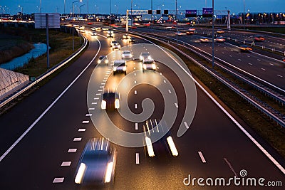 Evening traffic leaves light trails on the A9 highway Stock Photo