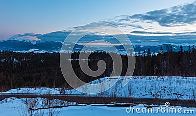 Evening twilight winter mountain ridge panorama Stock Photo