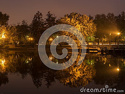 Evening lighting in the city by the lake Stock Photo