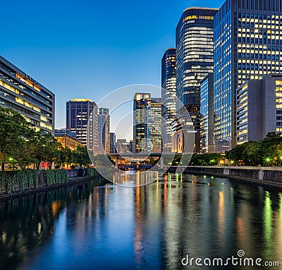 Evening view of Osaka downtown business area Okawa river Stock Photo