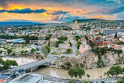 Evening View Of Tbilisi At Colorful Sunset. Georgia. Summer City Stock Photo