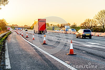 Evening view UK Motorway Services Roadworks Cones Stock Photo