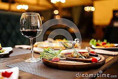 Evening wine celebration dinner table on blurry Stock Photo