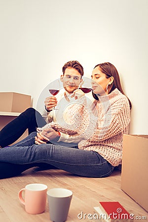 Couple feeling relaxed drinking some wine in the evening Stock Photo