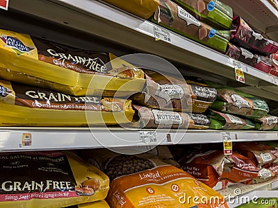 Everett, WA USA - circa June 2022: Angled close up of large bags of dry dog food for sale inside a Fred Meyer grocery store Editorial Stock Photo