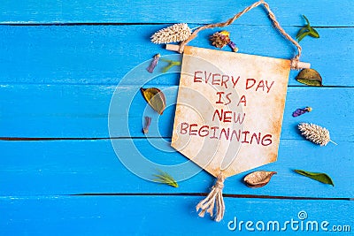 Every day is a new beginning text on Paper Scroll Stock Photo