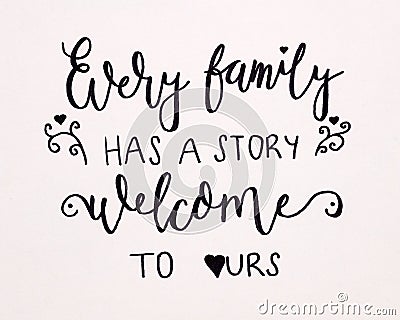 Every family has a story welcome to ours hand Calligraphy Stock Photo