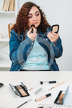 everyday makeup plus size woman office routine Stock Photo