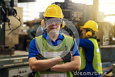 Everything is good concept. Technician or engineer in the factory showing the thumb. Well done. Asian man Industrial worker Stock Photo