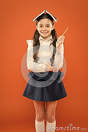 Everything is under control. Dealing with school stress. Girl child hold book. School girl studying textbook. Kid school Stock Photo