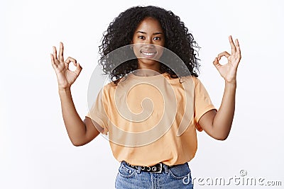 Everything under control. Portrait of confident energized attractive smiling african-american young girl curly haircut Stock Photo