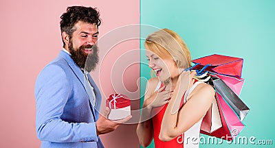 Everything she wants. Man bearded hipster hold gift box and girl enjoy shopping. Ask man to purchase lots presents for Stock Photo