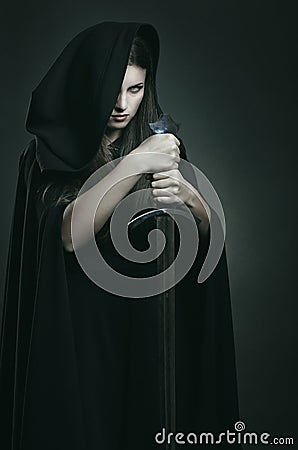 Evil expression of beautiful dark woman Stock Photo