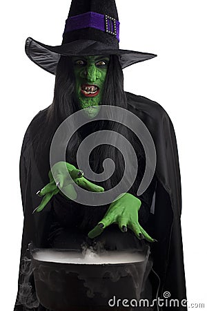 The evil green and her cauldron. Stock Photo