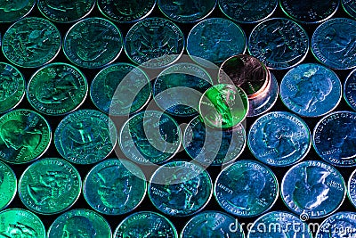Evil green penny over cool blue quarters interesting design Stock Photo