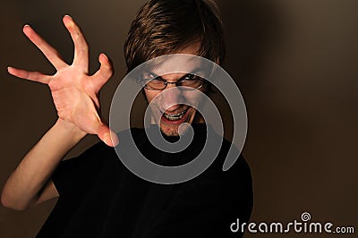 Evil Grin with Hand Stock Photo