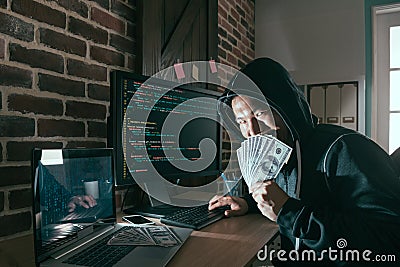 Evil hacker holding cash banknote cover face Stock Photo