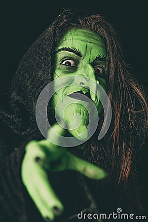 Evil witch casting a curse Stock Photo