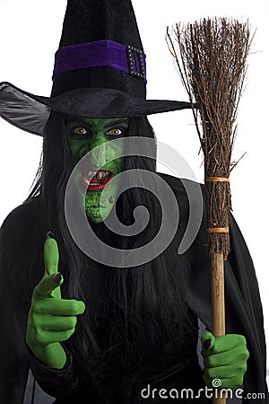 Evil witch and her broomstick. Stock Photo