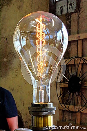 Large electric light bulb at a vintage market Editorial Stock Photo