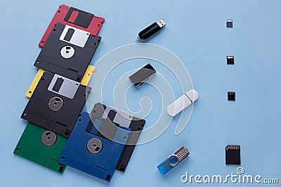The evolution of digital data storage device. Floppy disks, flash drives and small memory cards Stock Photo