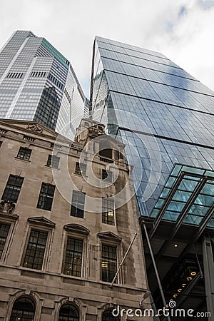 Evolving architecture. Old and modern design inner-city buildings blending together Stock Photo