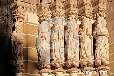 EVORA, PORTUGAL - OCTOBER 8, 2016: Close-up on the statues of the Apostles at the entrance of the Cathedral Editorial Stock Photo