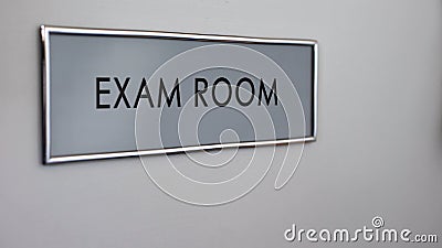 Exam room door desk closeup, student knowledge testing, higher education system Stock Photo