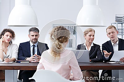 Examination board discussing resume Stock Photo