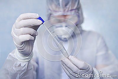 Examination of mucosal smears. The scientist is holding a test tube. Study of viruses in sputum of the lungs. Test for flu or Stock Photo