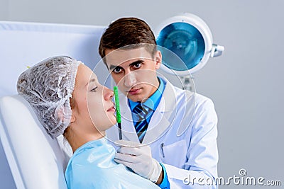 Plastic surgery doctor, patient inspection and consultation Stock Photo