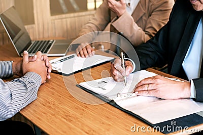 Examiner reading a resume during job interview at office Business and human resources concept Stock Photo