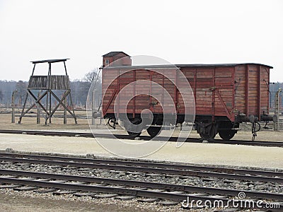 Train `Cattle` Car and Guard Tower. Editorial Stock Photo