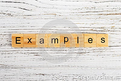 EXAMPLES word made with wooden blocks concept Stock Photo