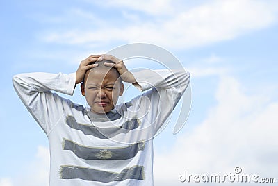 Exasperated bald female holding head Stock Photo