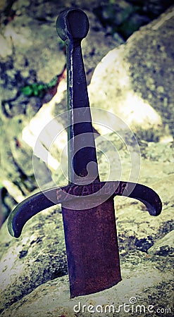 Excalibur is a legendary sword on the rock Stock Photo