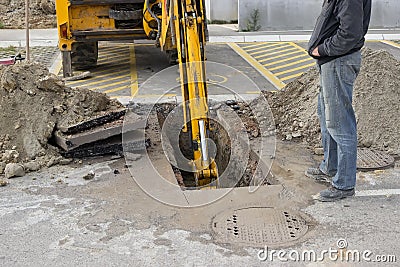 Excavating collapsed sewer line Stock Photo