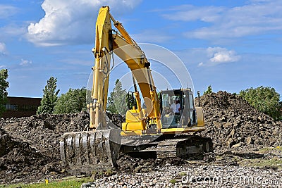 Excavating machine moves earth Stock Photo