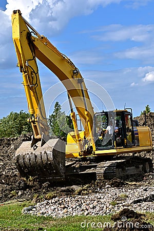 Excavating machine moves earth Stock Photo