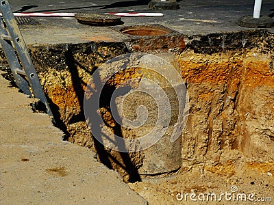 Excavation and repair after road collapse of asphalt surface Stock Photo
