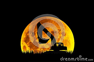 Excavator on the background of the full moon Stock Photo