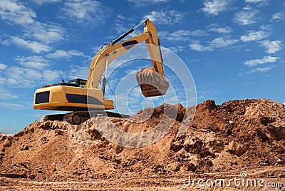 Excavator bulldozer in sandpit Stock Photo