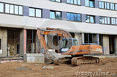 Excavator CASE CX210 working at construction site. Construction machinery for excavating, loading, Editorial Stock Photo