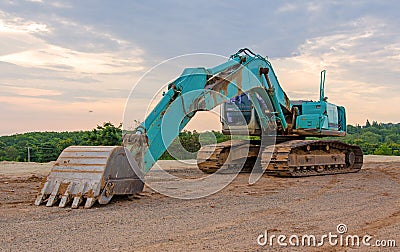 Excavator construction equipment park at worksite Stock Photo