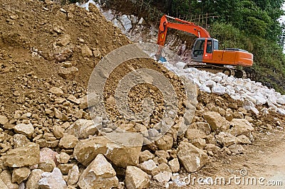 Excavator digging ground. Construction site with heavy machinery equipment Stock Photo