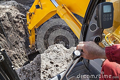 Excavator digging hole ground Stock Photo