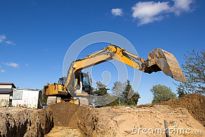 Excavator digging sewer trenche Stock Photo